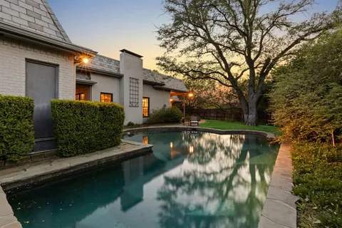 a view of swimming pool with a patio