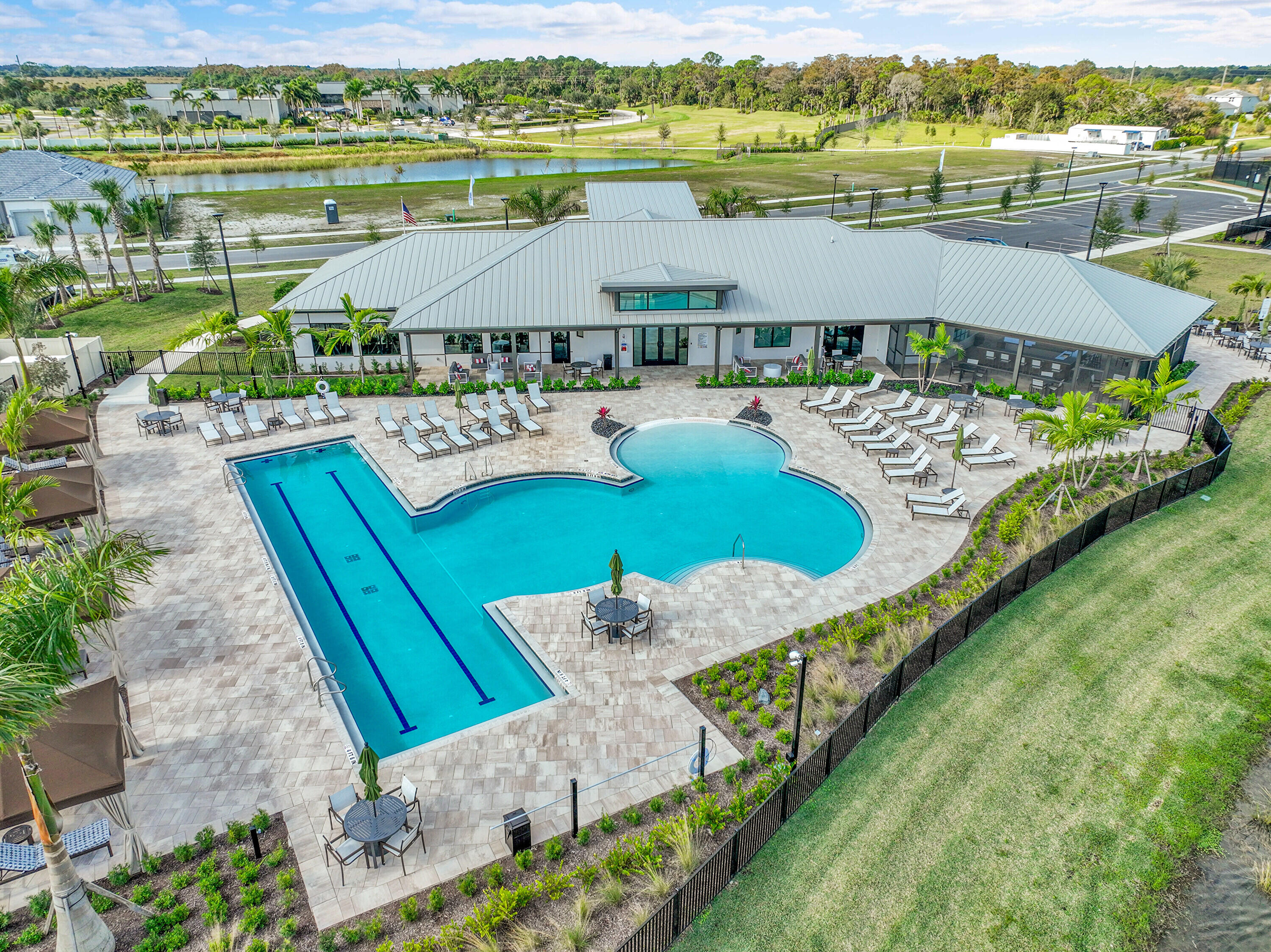 9765 Southwest Meridian Way Stuart, FL 34997 - Photo 43 of 46 an aerial view of a house with a garden and lake view