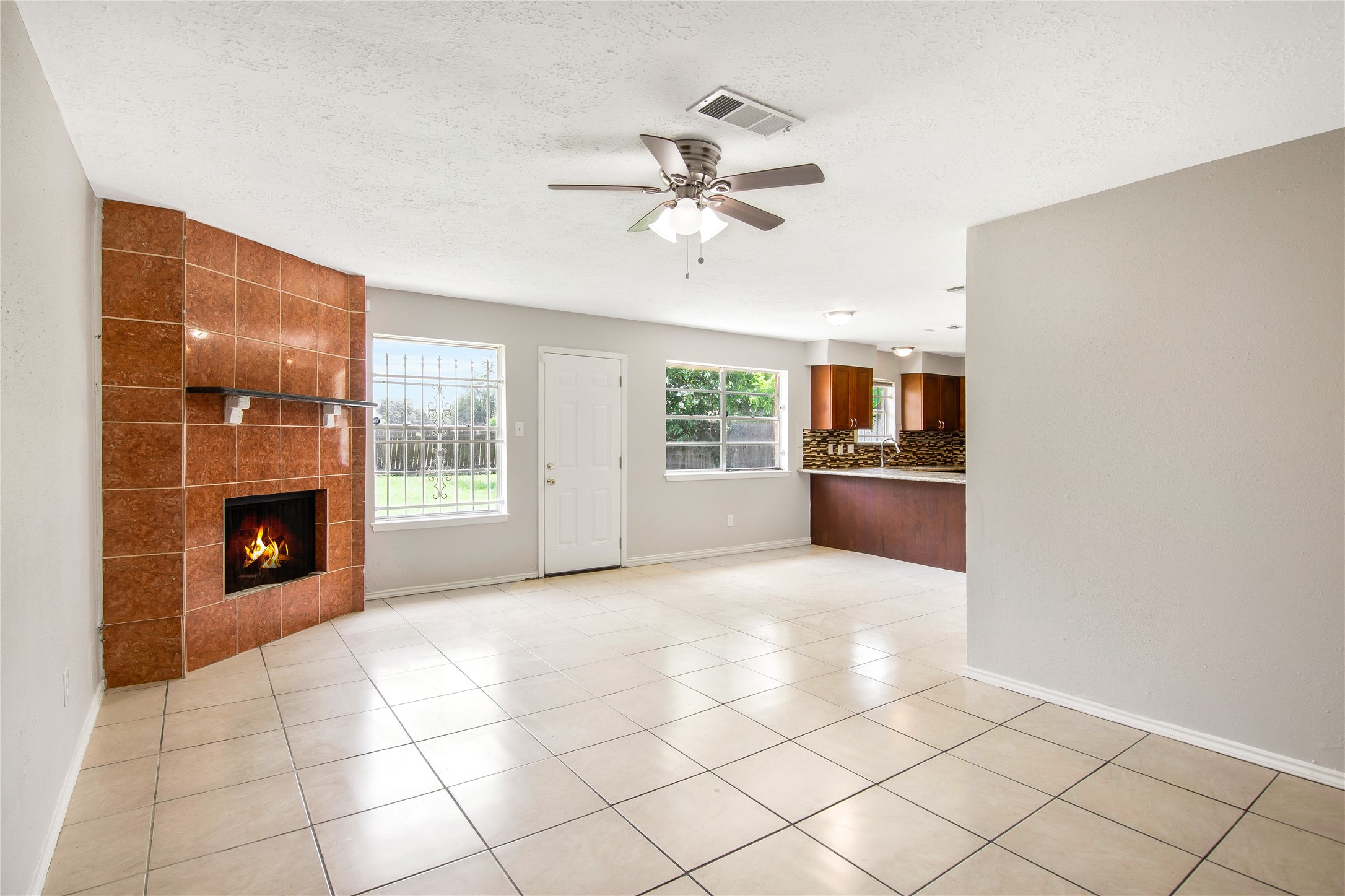 11710 Old Telegraph Road Houston, TX 77067 - Photo 6 of 24 Enjoy corner wood-burning fireplace in tiled family room.