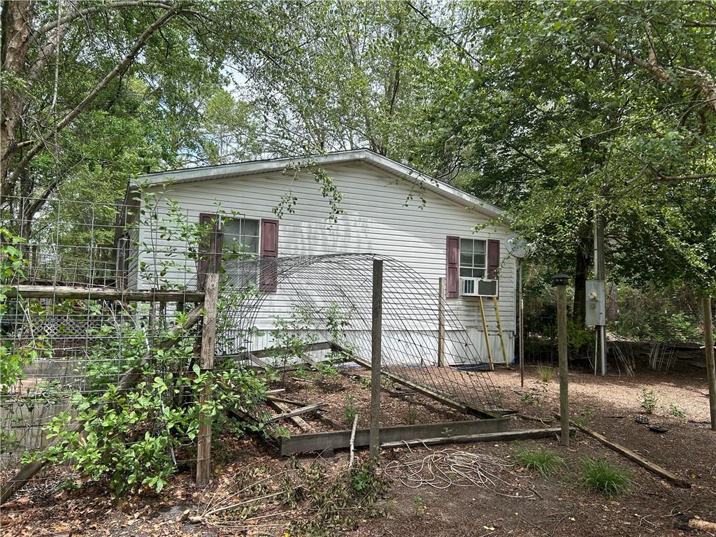 114 Jones Road Hortense, GA 31543 - Photo 5 of 25 a backyard of a house with lots of green space