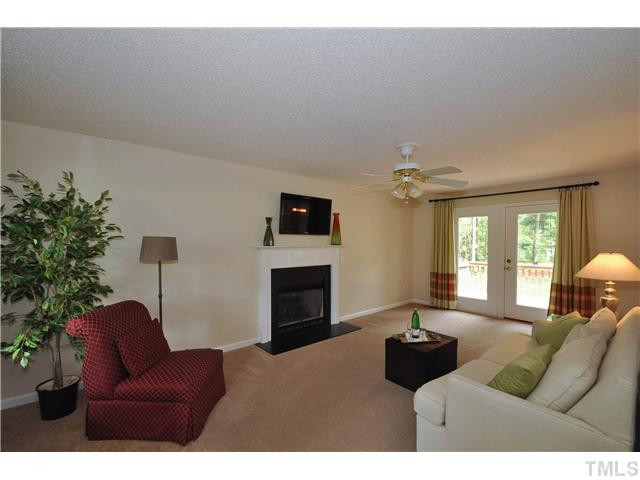 223 Ridge Drive Garner, NC 27529 - Photo 2 of 20 Beautiful living room with access to the wonderful back deck, new carpet and paint, and an elegant gas log fireplace Living Room
