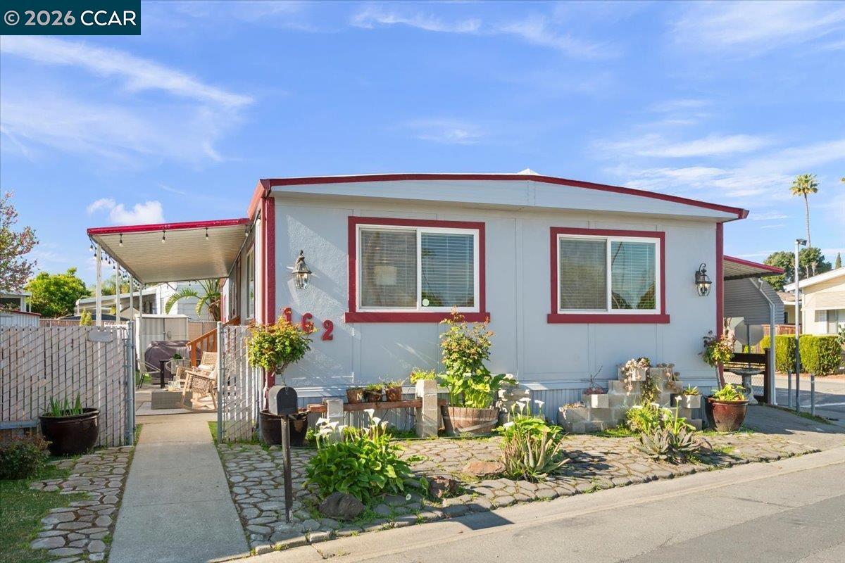 a front view of a house with garden