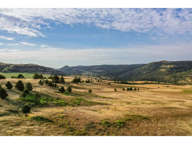 a view of an ocean and mountain