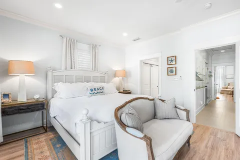 a bedroom with a bed and a lamp