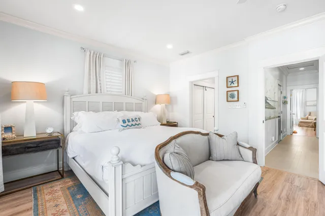 a bedroom with a bed and a lamp