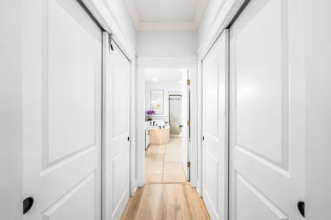 a view of a bathroom from a hallway
