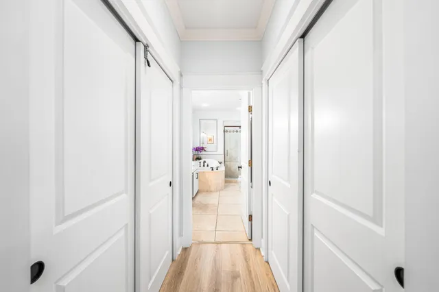 a view of a bathroom from a hallway