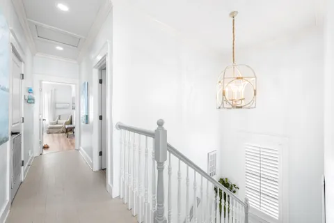 a view of a hallway with a chandelier