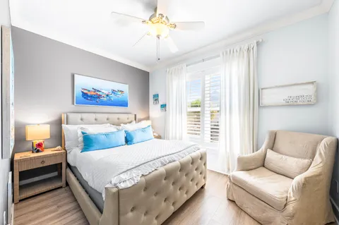 a bedroom with a bed and a couch