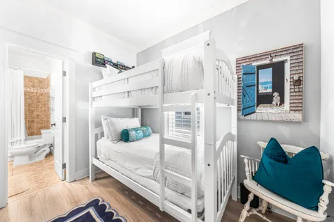 a bedroom with a bed and a mirror