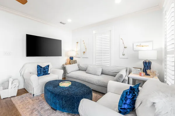 a living room with furniture and a flat screen tv