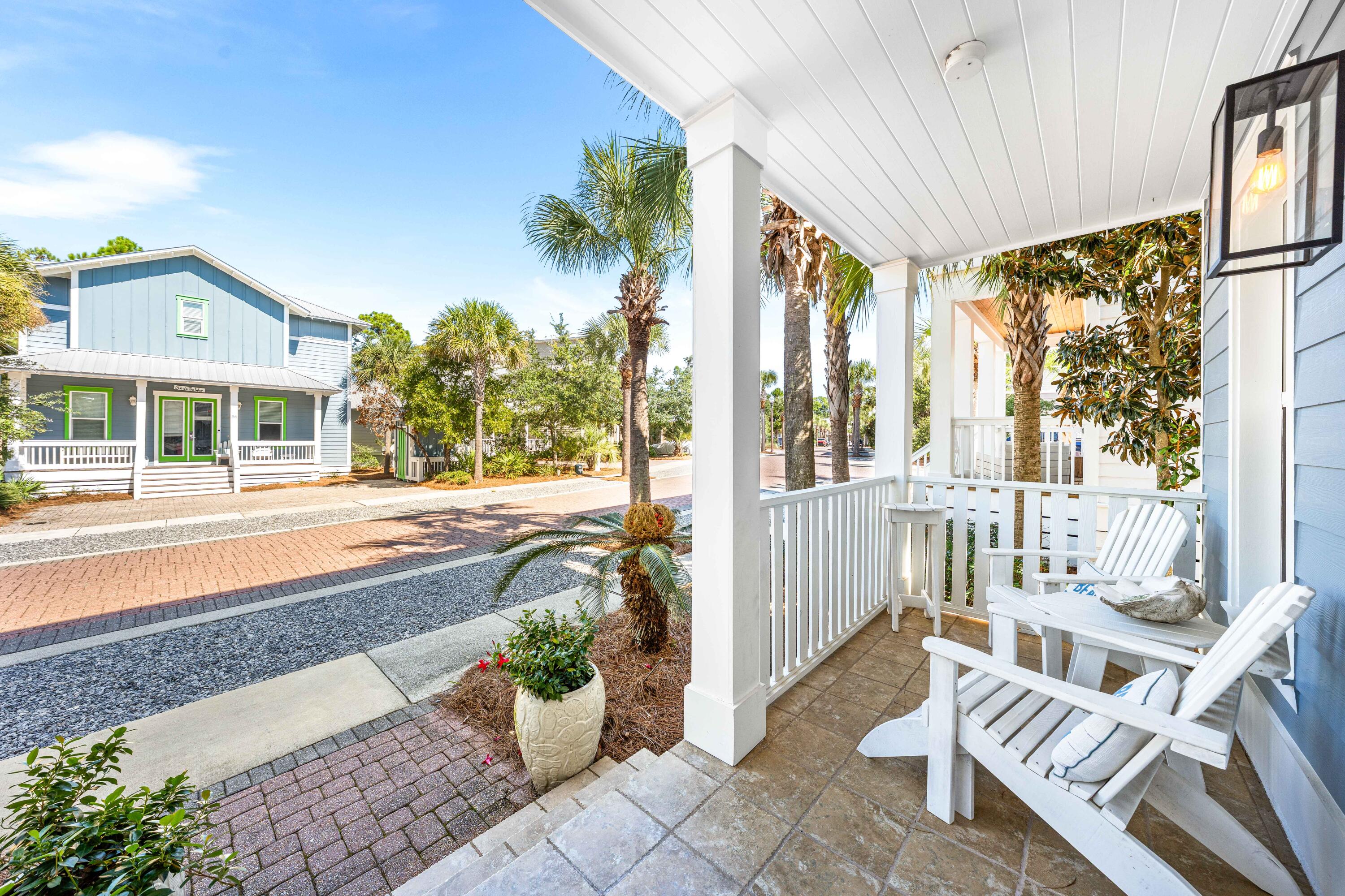 59 Endless Summer Way West Inlet Beach, FL 32461 - Photo 33 of 40 a front view of a house with outdoor seating and a potted plant