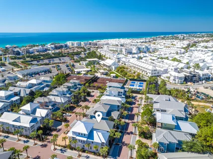 an aerial view of residential houses with outdoor space