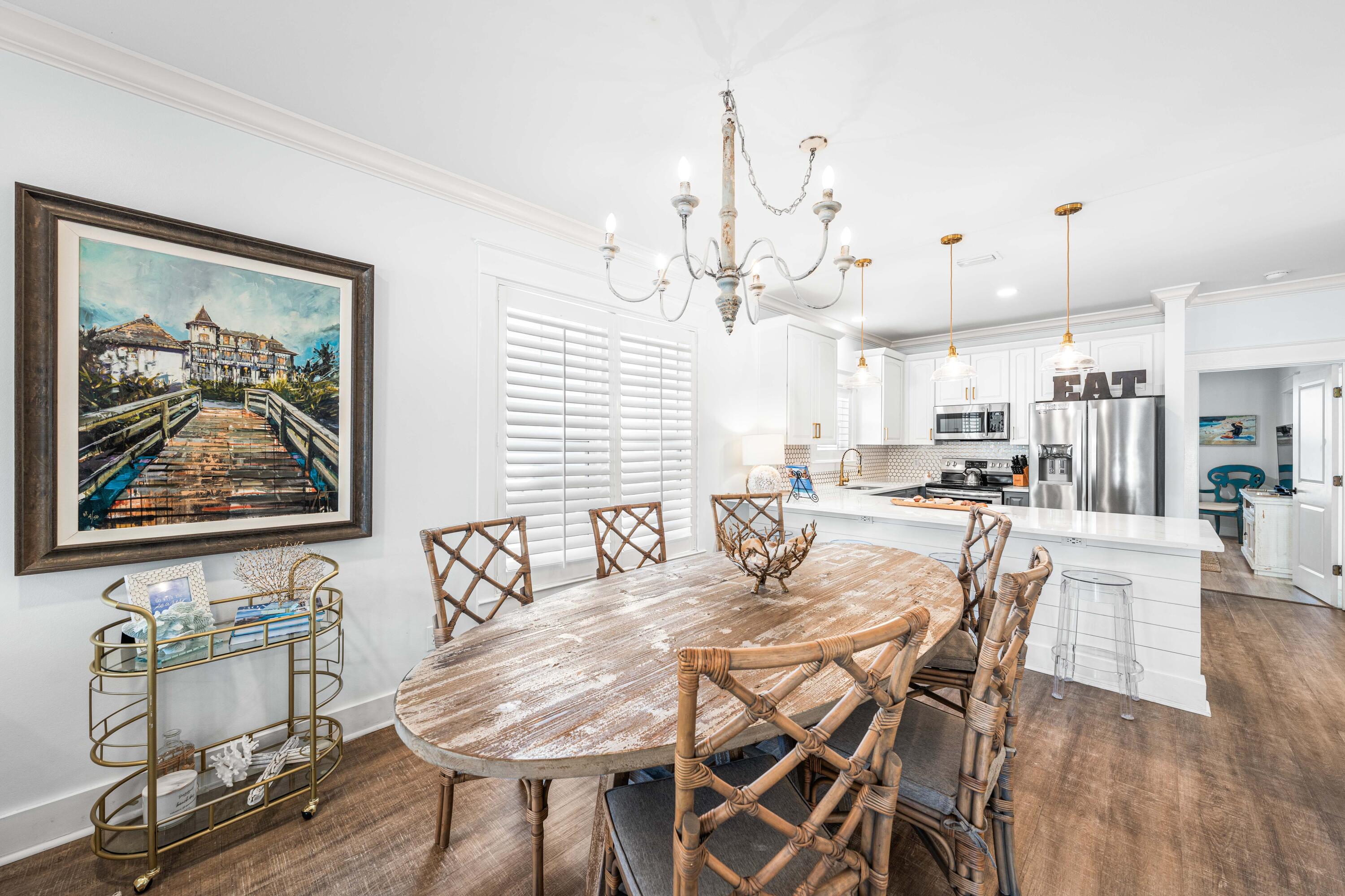 59 Endless Summer Way West Inlet Beach, FL 32461 - Photo 9 of 40 a view of a dining room with furniture wooden floor and a chandelier