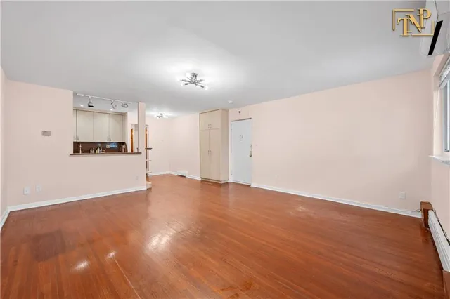 a view of a kitchen with a dishwasher and a refrigerator