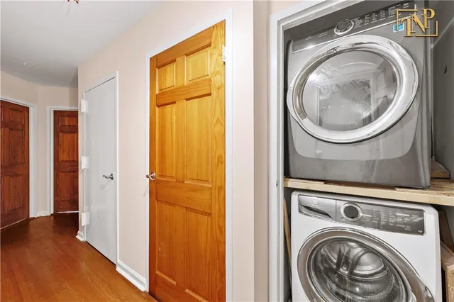 a view of a hallway with washer and dryer