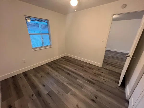 a view of wooden floor in an empty room