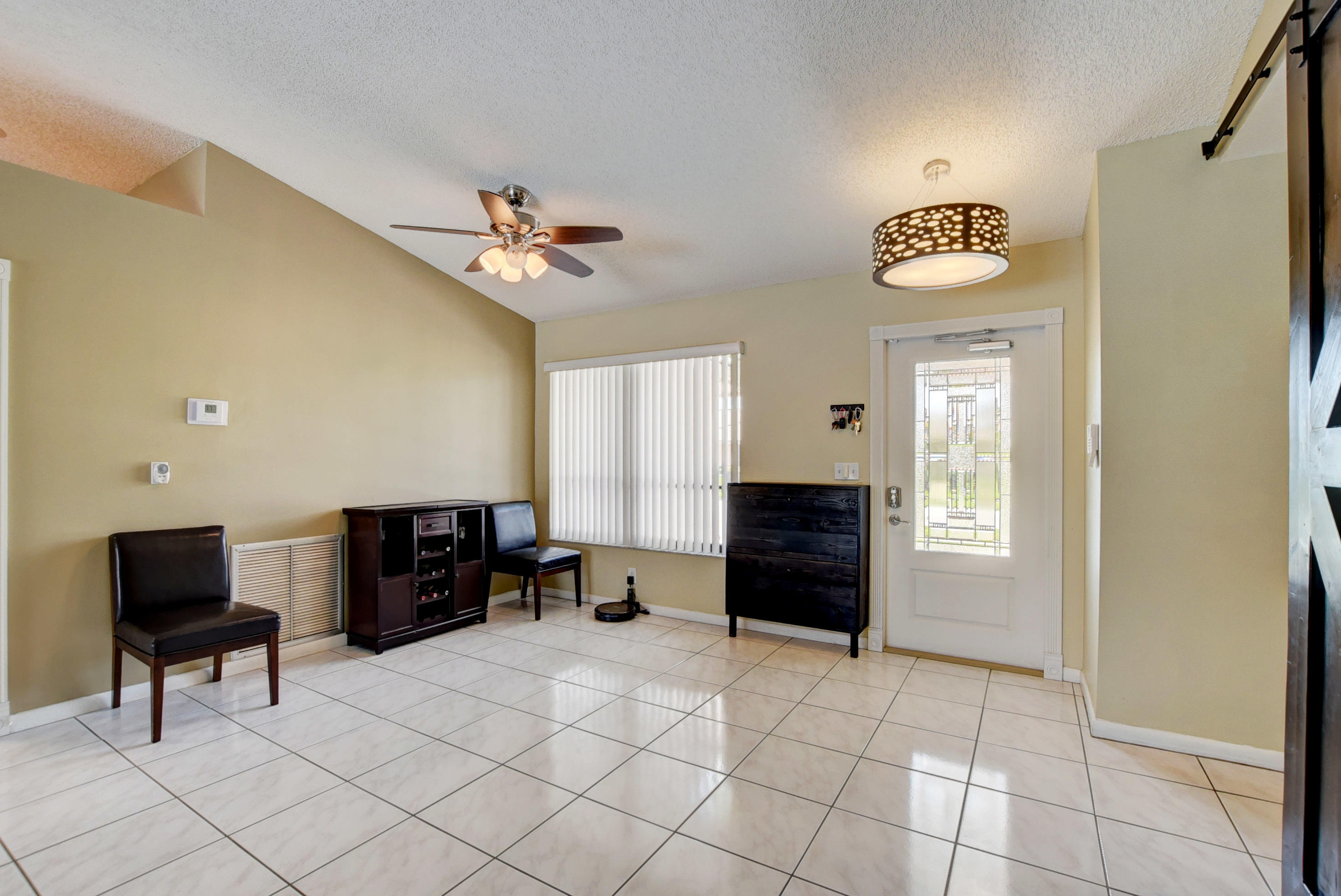 491 Northwest 72nd Street Boca Raton, FL 33487 - Photo 3 of 57 a living room with furniture