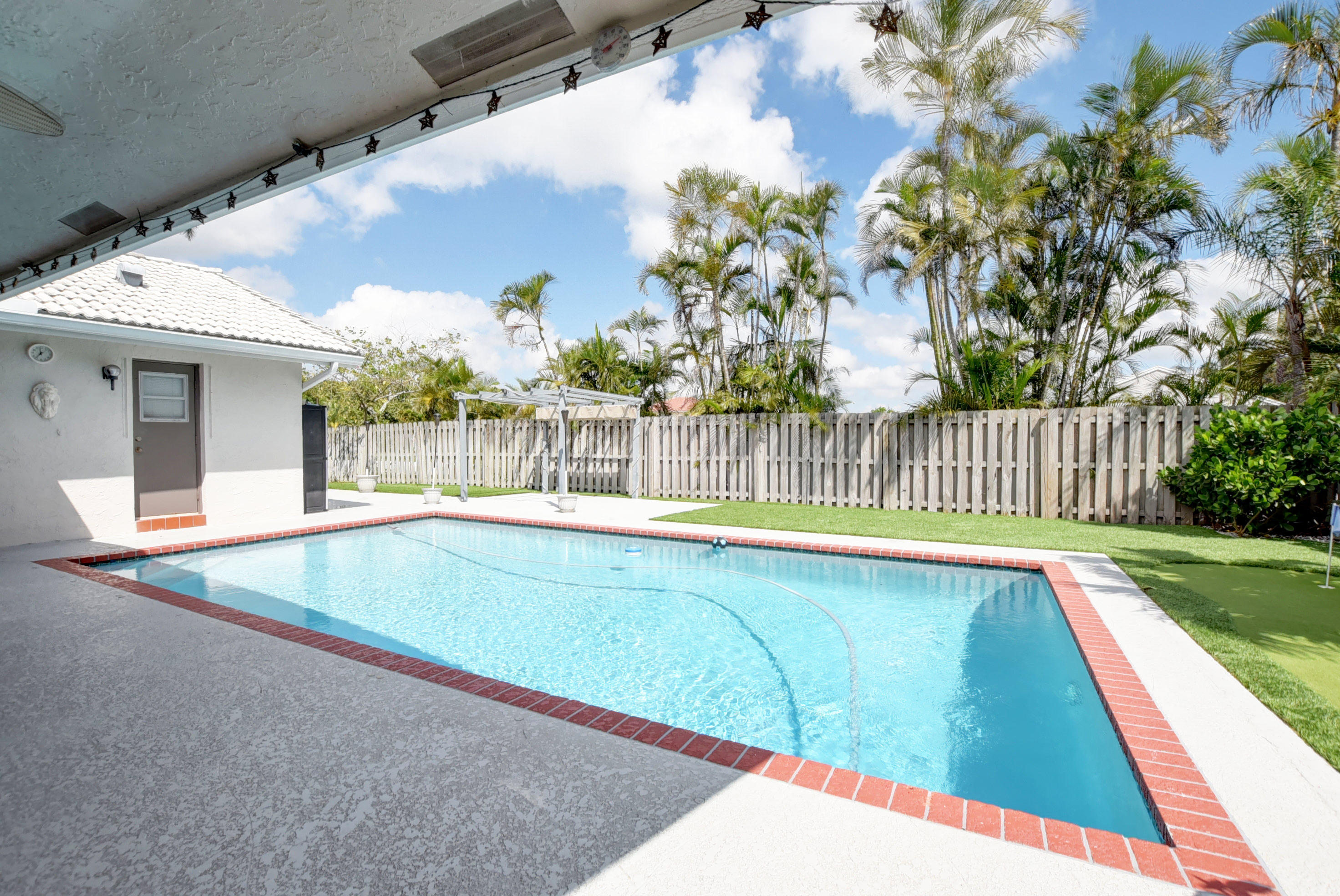 491 Northwest 72nd Street Boca Raton, FL 33487 - Photo 34 of 57 a view of swimming pool with seating area