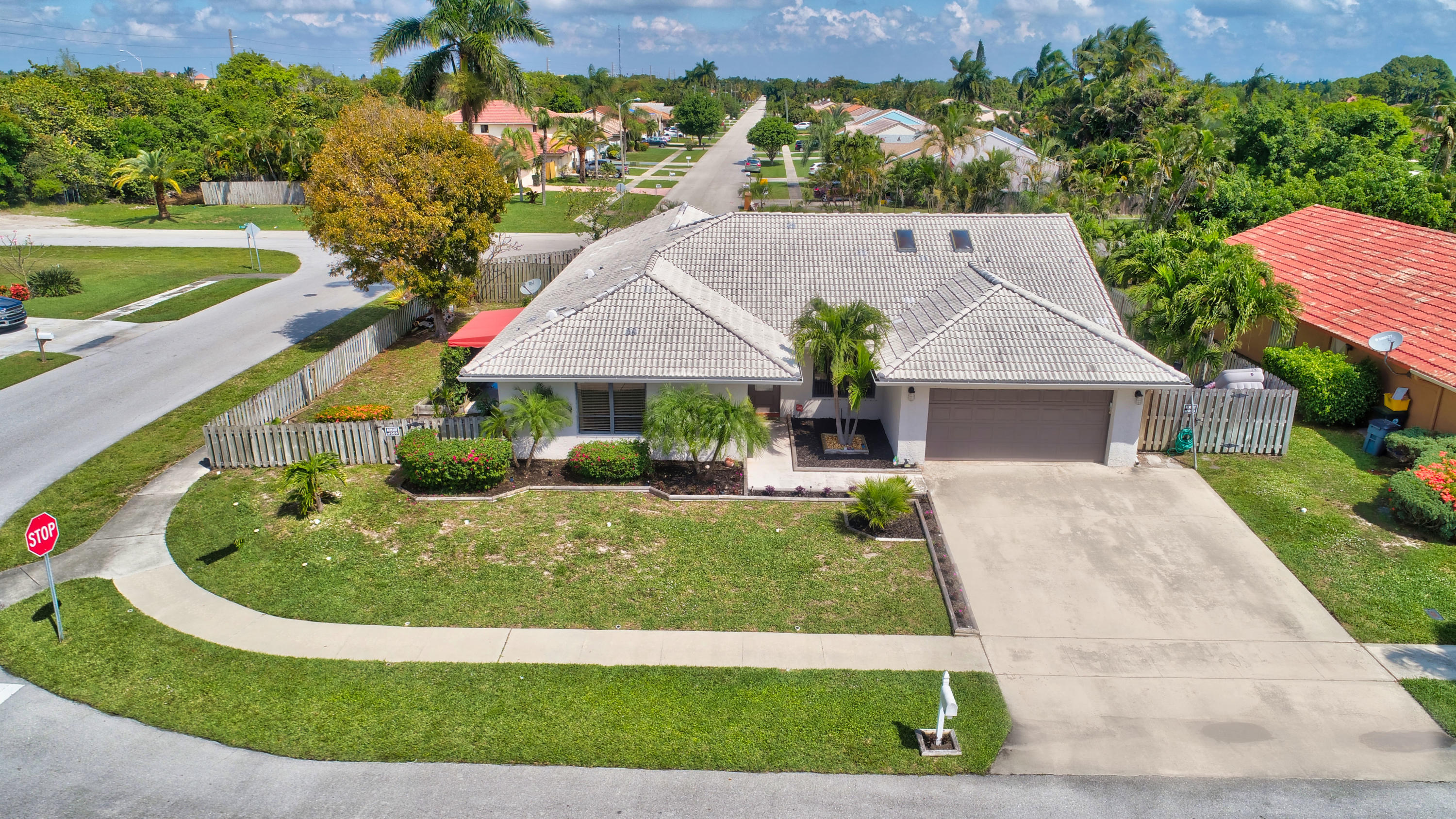 491 Northwest 72nd Street Boca Raton, FL 33487 - Photo 44 of 57 a front view of a house with a yard