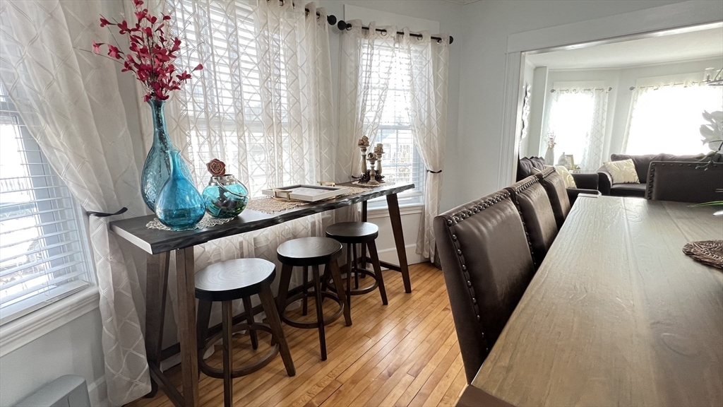 603 Temple Street Whitman, MA 02382 - Photo 13 of 40 a view of a dining room with furniture window and wooden floor