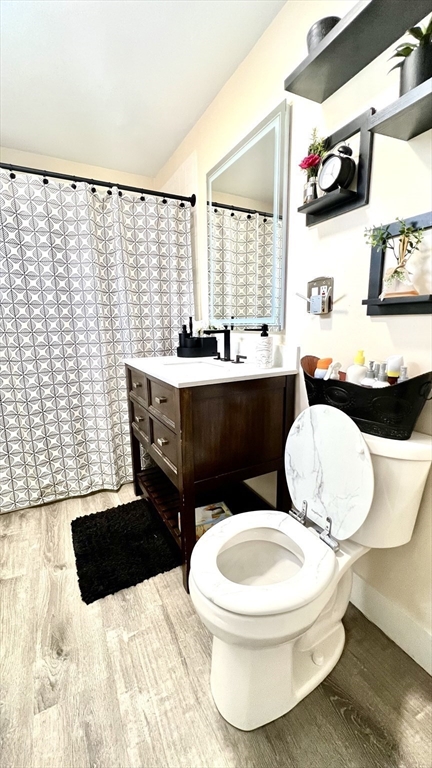 603 Temple Street Whitman, MA 02382 - Photo 15 of 40 a bathroom with a sink toilet and mirror