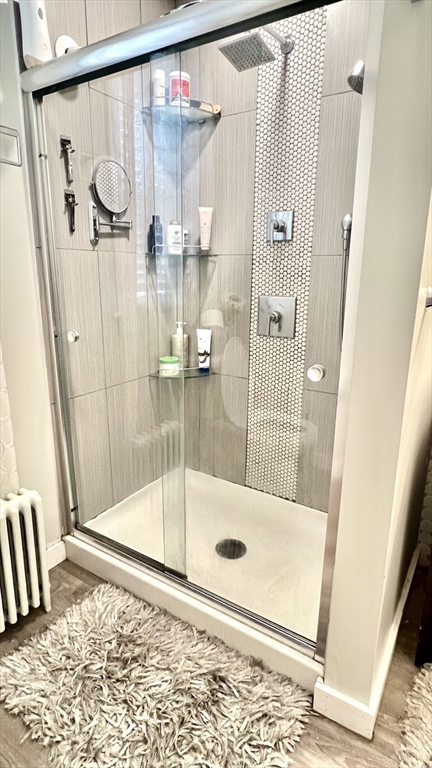 603 Temple Street Whitman, MA 02382 - Photo 20 of 40 a bathroom with a glass shower door