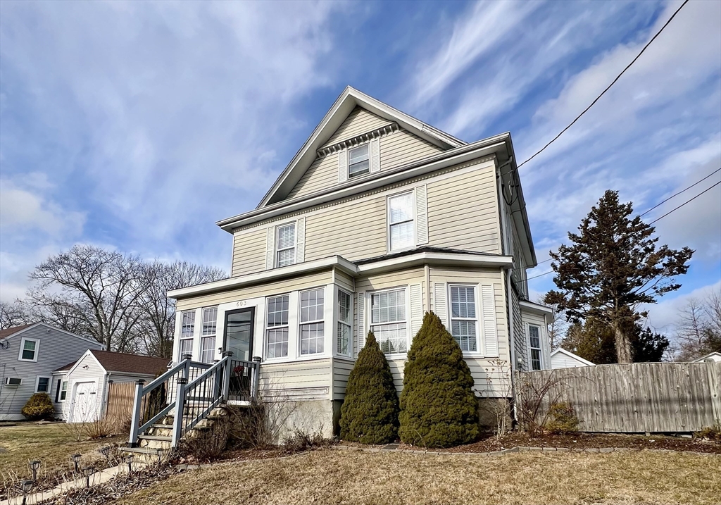 603 Temple Street Whitman, MA 02382 - Photo 2 of 40 a front view of a house with a yard