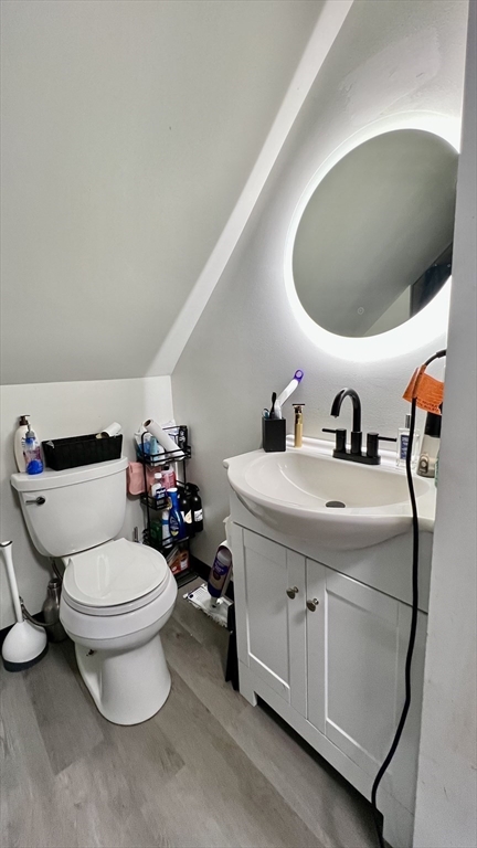 603 Temple Street Whitman, MA 02382 - Photo 23 of 40 a bathroom with a toilet sink and mirror