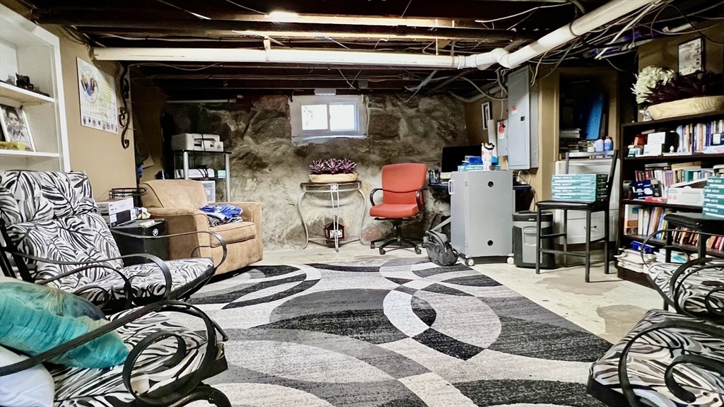 603 Temple Street Whitman, MA 02382 - Photo 24 of 40 a storage room with furniture and a rug