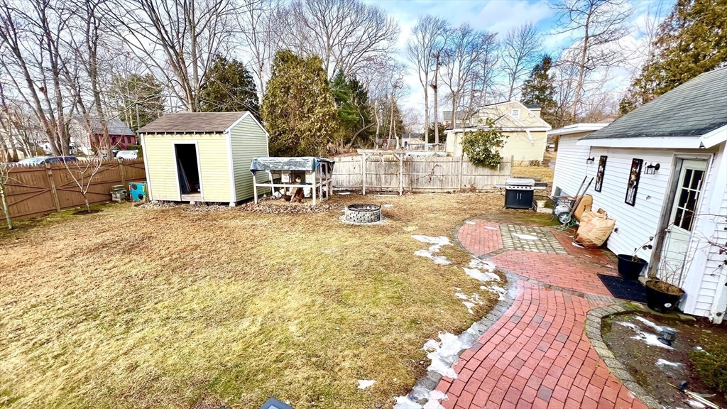 603 Temple Street Whitman, MA 02382 - Photo 26 of 40 a view of a house with backyard and sitting area