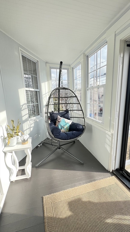 603 Temple Street Whitman, MA 02382 - Photo 32 of 40 a living room with a couch and a table