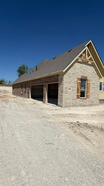 1002 Perrin Lane Van Alstyne, TX 75495 - Photo 3 of 9 a house with trees in the background