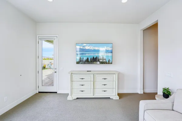 a large bathroom with a double vanity sink large mirror and a bathtub