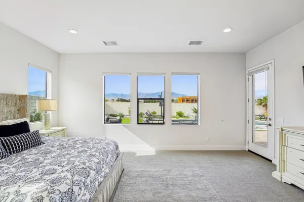 a view of a house with backyard sitting area