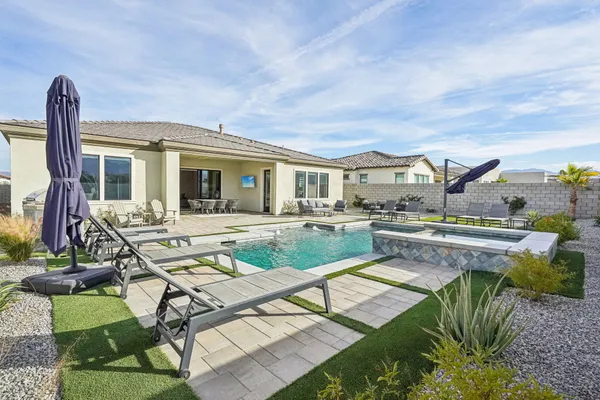 a view of a swimming pool with a terrace