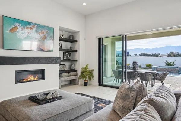a living room with furniture a window and a fireplace