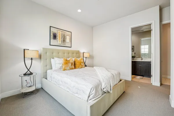 a bedroom with a bed and a view of bathroom