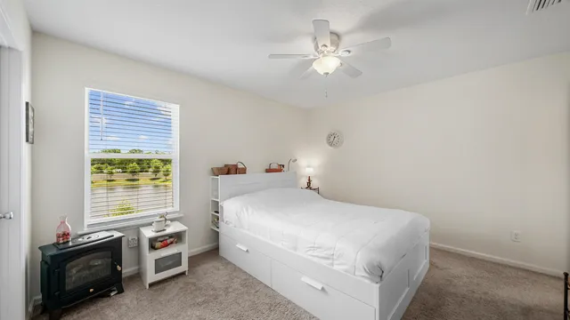 a bedroom with a bed and a tv