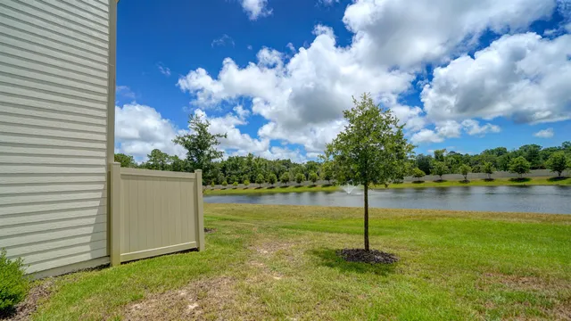 a view of a lake with houses in the back