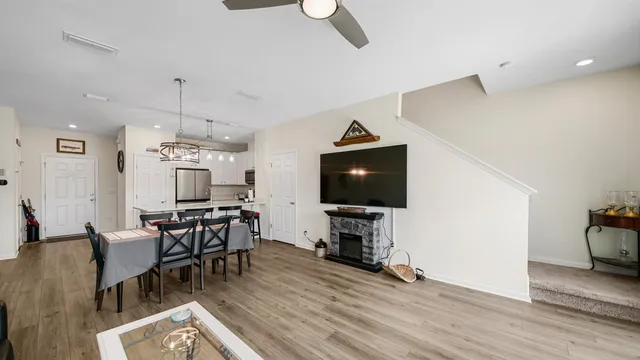 a view of a livingroom with furniture and a flat screen tv