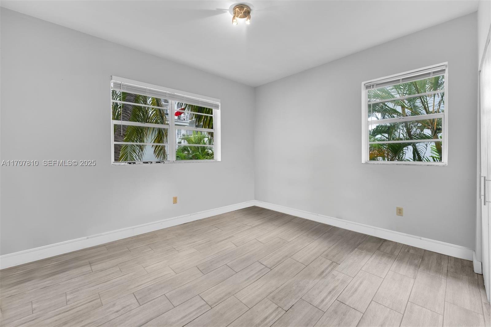1622 Bay Road Miami Beach, FL 33139 - Photo 18 of 24 an empty room with windows