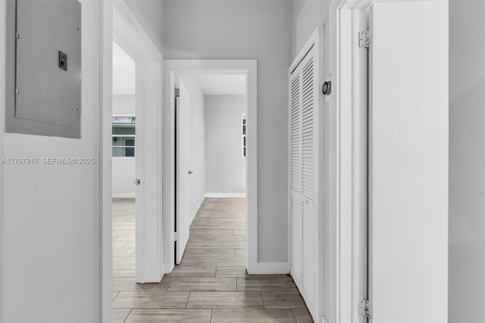1622 Bay Road Miami Beach, FL 33139 - Photo 19 of 24 a view of a hallway with wooden floor
