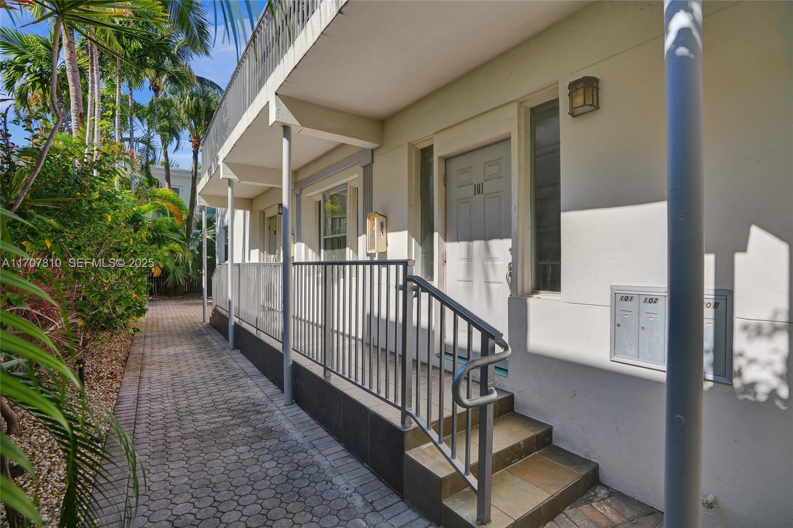 1622 Bay Road Miami Beach, FL 33139 - Photo 2 of 24 a view of a house with a small yard and deck