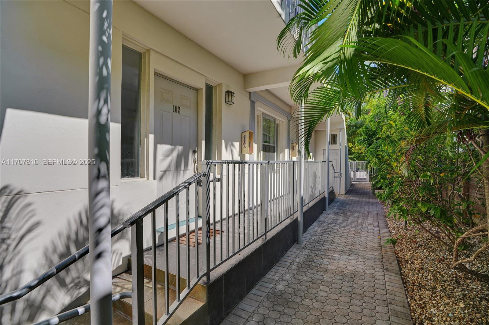 1622 Bay Road Miami Beach, FL 33139 - Photo 23 of 24 a view of a house with a small yard