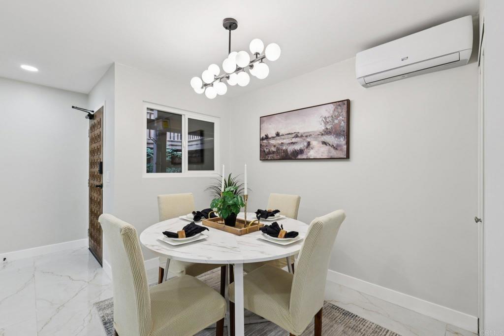 2600 Torrey Pines Road, Unit A13 La Jolla, CA 92037 - Photo 11 of 65 a view of a dining room with furniture and chandelier