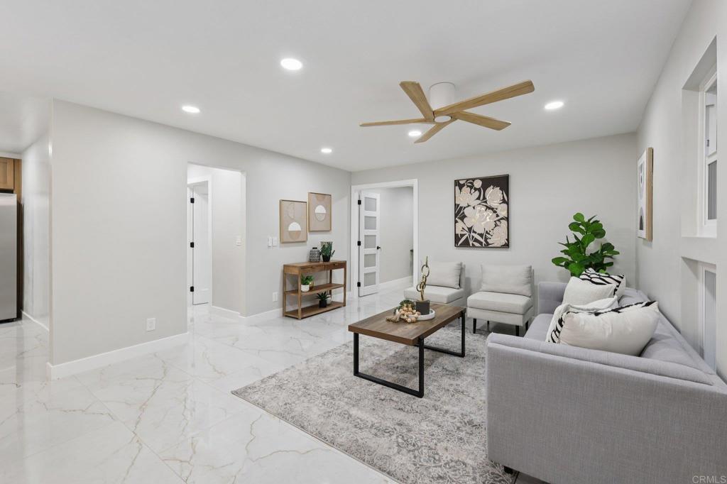 2600 Torrey Pines Road, Unit A13 La Jolla, CA 92037 - Photo 13 of 65 a living room with furniture and a ceiling fan