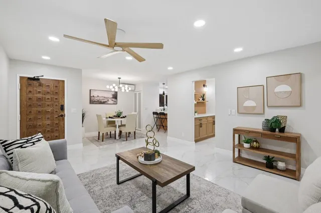 a kitchen with stainless steel appliances a sink and a refrigerator