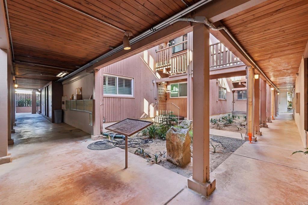 2600 Torrey Pines Road, Unit A13 La Jolla, CA 92037 - Photo 21 of 65 a view of a porch with chairs and potted plants