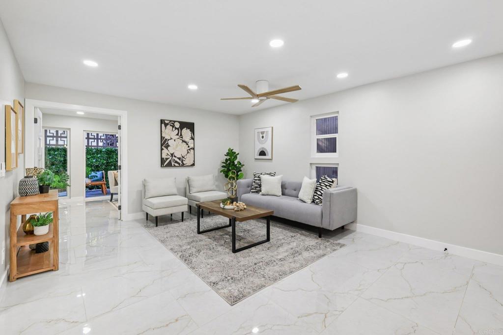 2600 Torrey Pines Road, Unit A13 La Jolla, CA 92037 - Photo 23 of 65 a living room with furniture and a large window